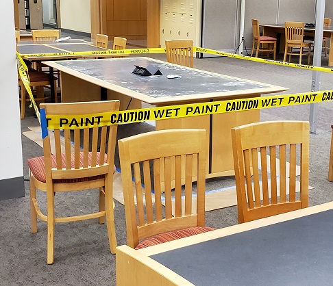 Maintenance work on tables in the library