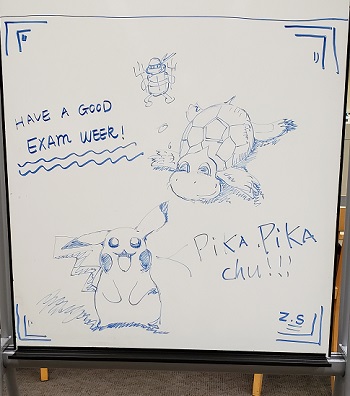 A whiteboard with pokemon on it